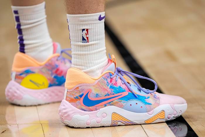 View of Kevin Hueter's pink and blue Nike PG 6 shoes.